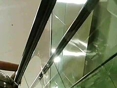 Seductive girl rides escalator in upskirt