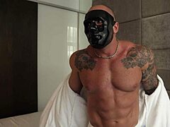 A masked twink gives a handjob and edging to a big dick bodybuilder