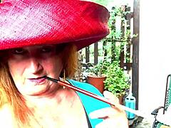 Mistress Augusta indulges in decadent smoking and refined fetish play