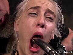 Bound and gagged blonde gets fucked in rough dungeon