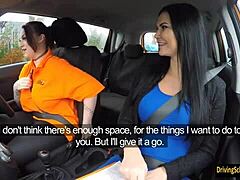 Busty brunette Harmony Reigns gets her boobs played with by an examiner in the car