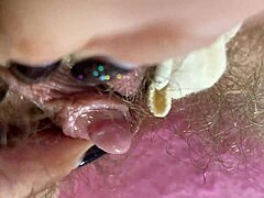 Amateur babe with hairy pussy gets off on close-up masturbation