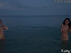 Two naked sluts enjoy public beach playtime